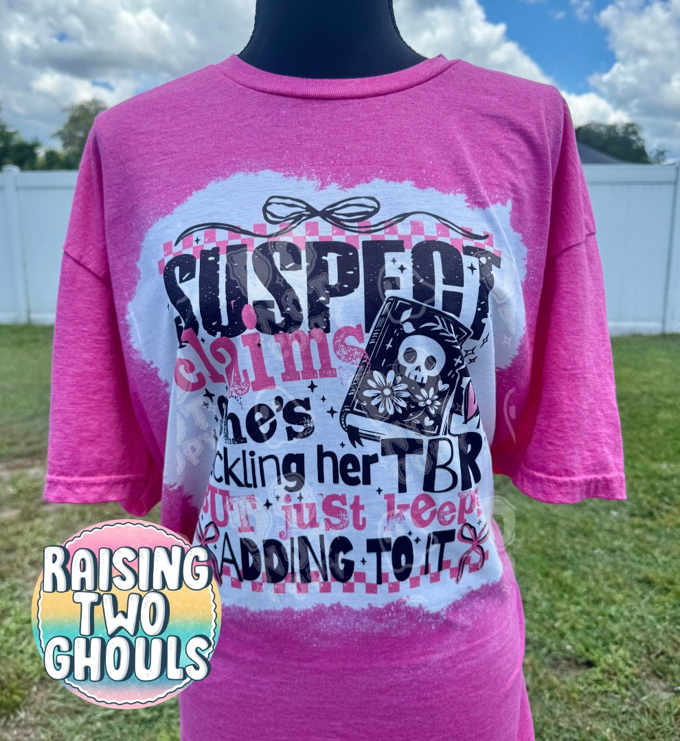 Suspect Claims She’s Tackling Her TBR But Just Keeps Adding to It Tee