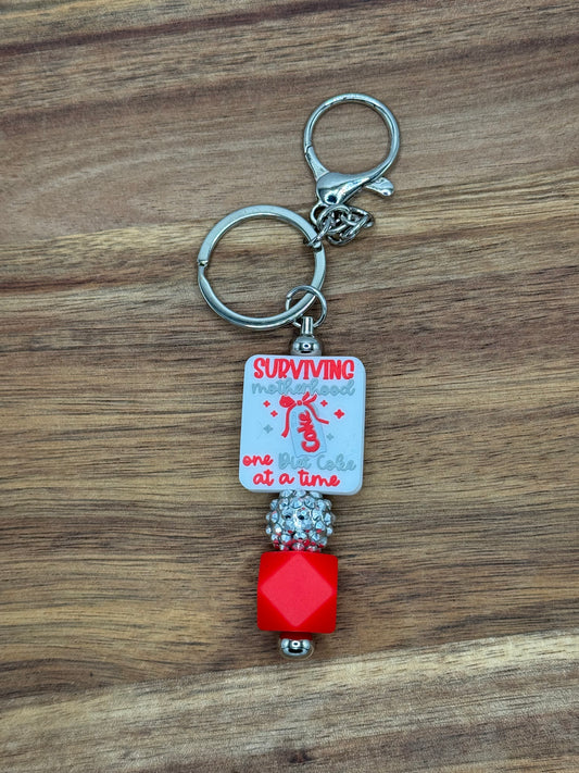 Surviving Motherhood One Diet Coke at a Time Beaded Keychain