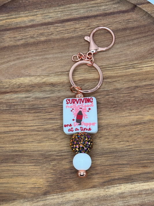 Surviving Motherhood One Dr Pepper at a Time Beaded Keychain